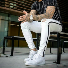 Carregar imagem no visualizador da galeria, CALÇA BRANCA SKINNY LISTRA PRETA LATERAL / CORDÃO NO CÓS
